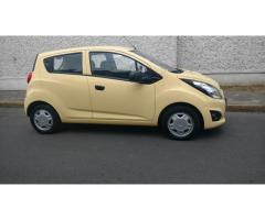 chevrolet spark 2014 amarillo